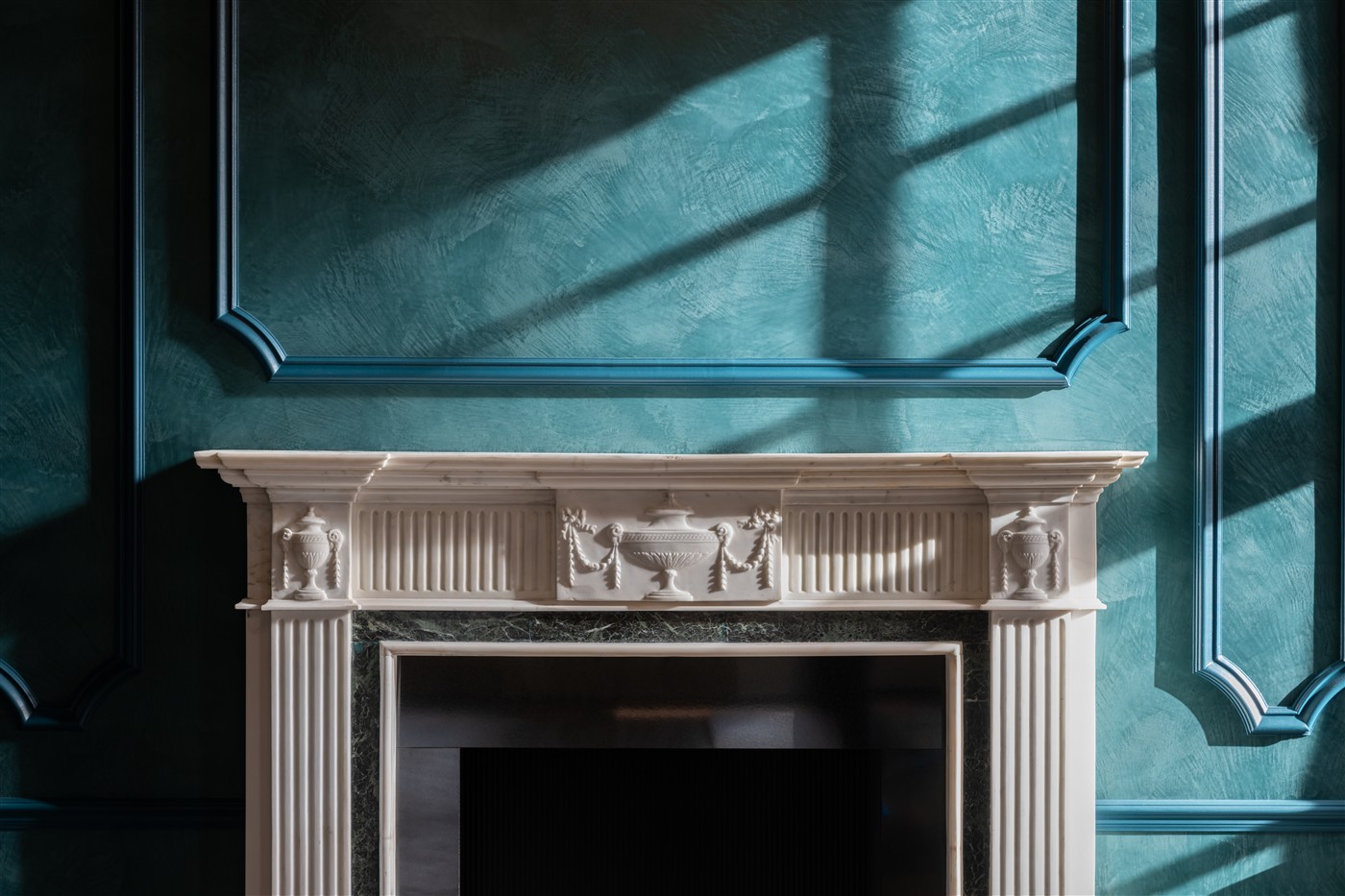 Marmorino, teal room with fireplace