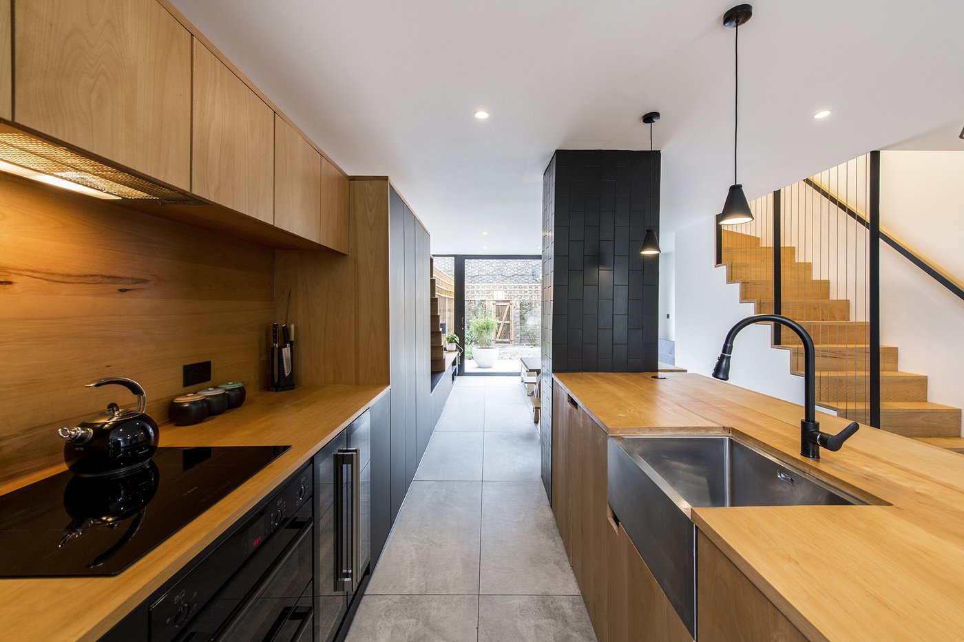 Refurbished London house at Copeland Road using standard components and tailored detailing