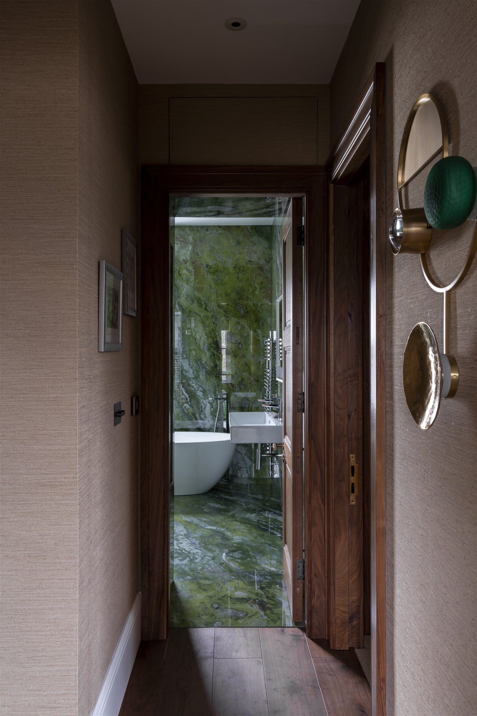 The bathroom glimpsed from the hallway