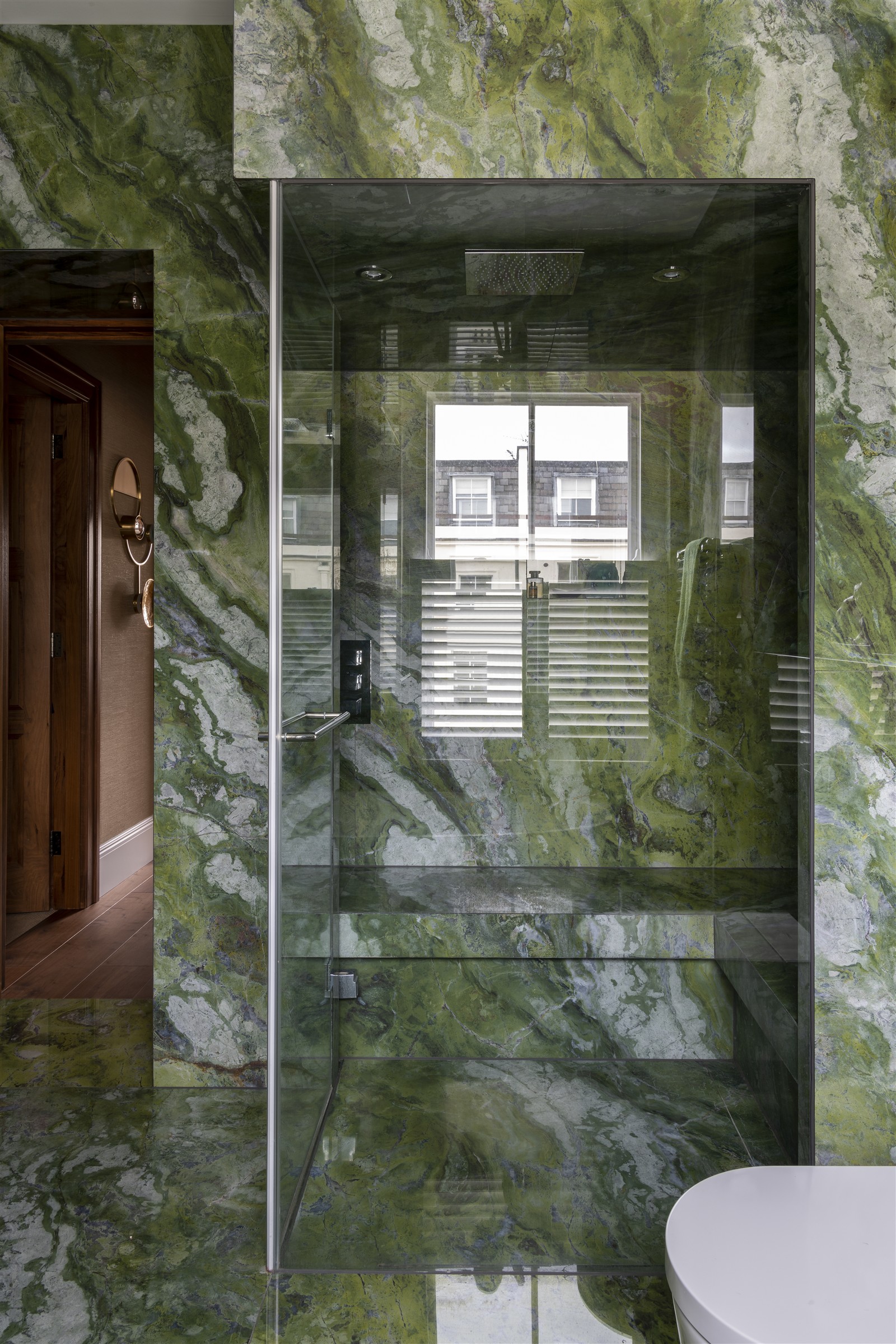 Inside the green marble bathroom